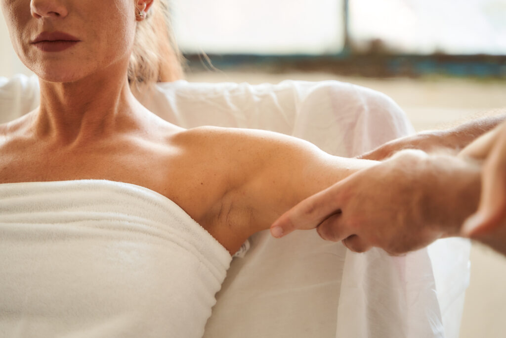 Steve massaging the bicep of a client